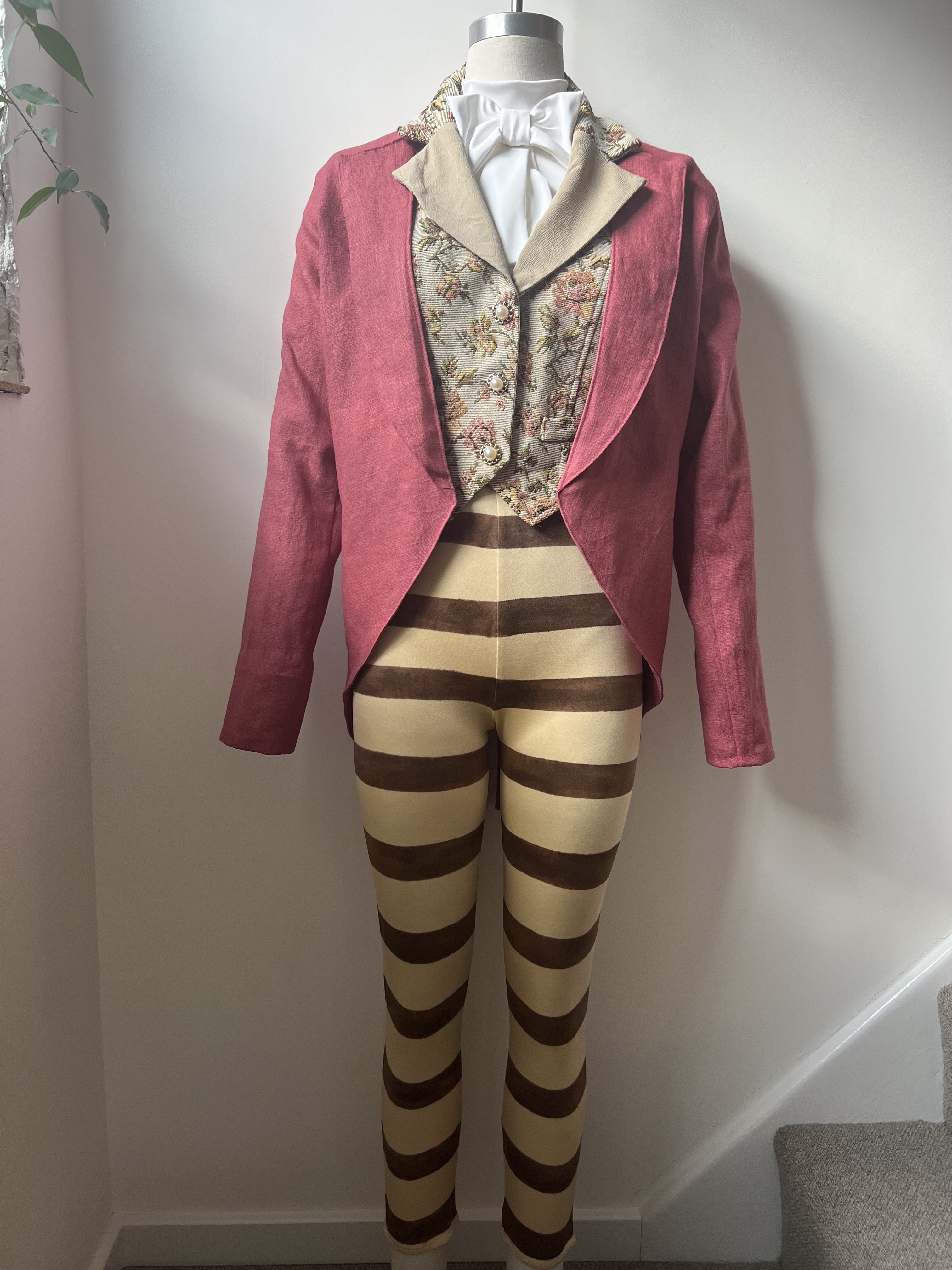 Pink and gold striped costume